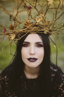 Gothic Caucasian woman wearing crown of branches