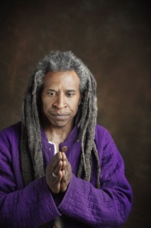 African man with dreadlocks praying