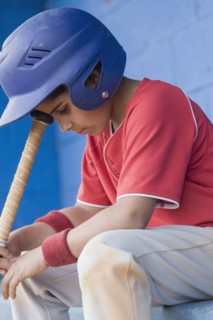 Sad Hispanic baseball player
