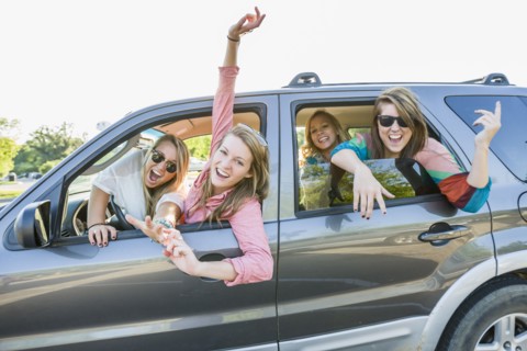 Playful friends in car