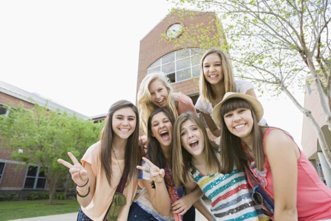 Smiling Caucasian friends standing together