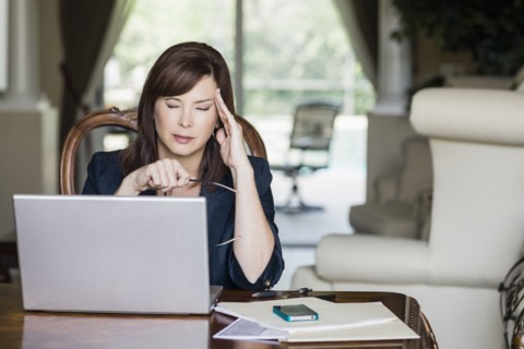 Caucasian businesswoman with headache