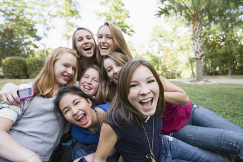 Friends hanging out together on grass