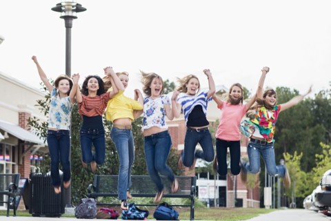 Friends hanging out together and jumping