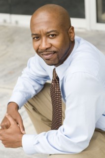 Black businessman sitting outdoors