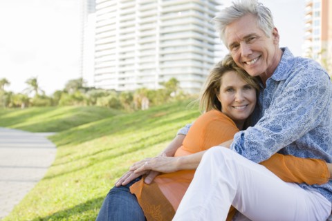 Caucasian couple relaxing in city park
