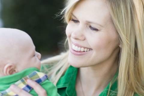 Caucasian mother holding baby