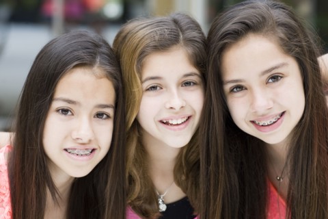 Hispanic girls smiling together