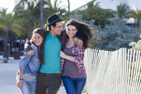 Friends walking on beach