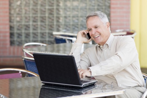 Caucasian businessman working at cafe