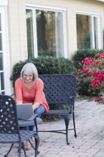 Caucasian woman using laptop outdoors