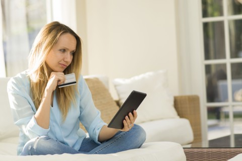 Caucasian woman shopping online with digital tablet