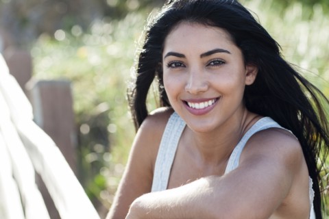 Hispanic woman smiling outdoors