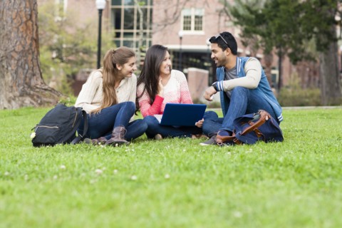Students using laptop on campus