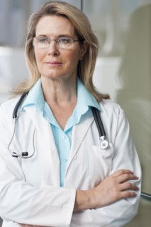 Caucasian doctor standing with arms crossed