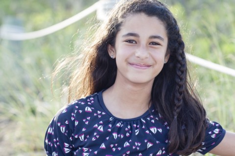 Mixed race girl smiling outdoors