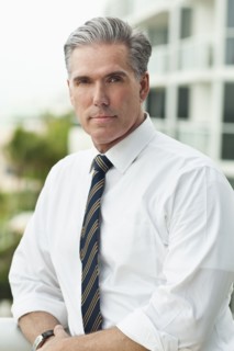 Close up of serious Caucasian businessman outdoors