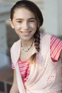 Close up of Hispanic girl smiling