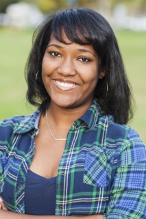 African American teenage girl smiling outdoors