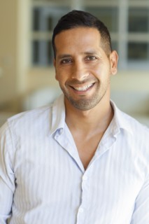 Close up of Hispanic man smiling