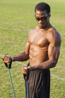 Black athlete working out on sports field