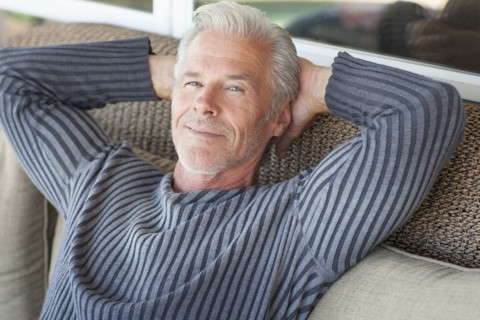 Caucasian man relaxing on sofa