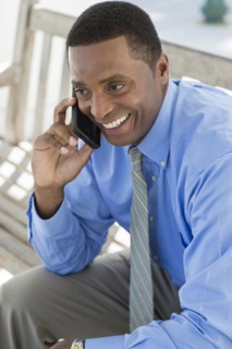 Black businessman talking on cell phone
