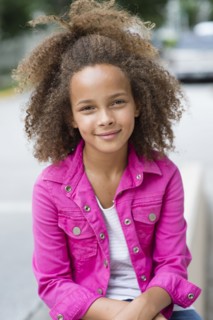 Mixed race girl smiling outdoors