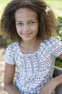 Mixed race girl smiling outdoors