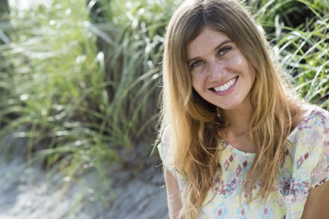 Caucasian woman smiling on beach