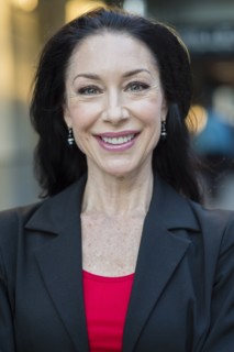 Caucasian businesswoman smiling outdoors