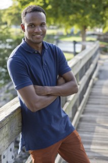 Black man smiling outdoors