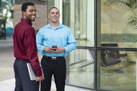 Businessmen smiling outdoors