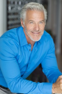 Smiling Caucasian man leaning