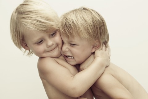 Caucasian boys wrestling