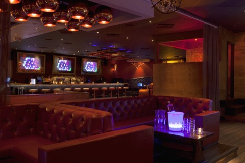 Tables and booths in empty nightclub