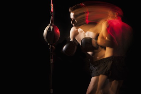 Blurred view of Caucasian boxer training