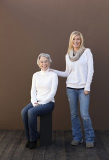 Caucasian mother and daughter smiling together