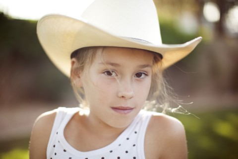 Caucasian girl in cowboy hat