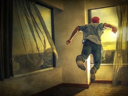 Caucasian man flying through window