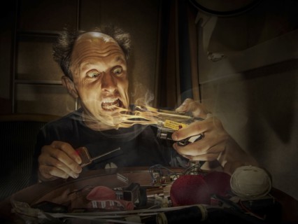 Caucasian inventor examining flame-thrower