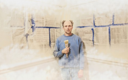 Caucasian man painting himself into corner
