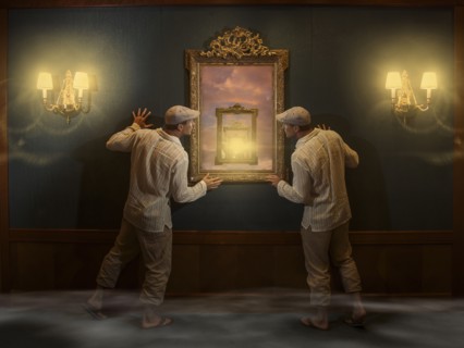 Caucasian twins peering into mirror