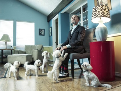 Caucasian businessman ignoring begging dogs