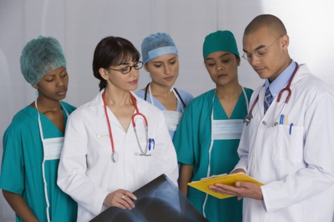 Multi-ethnic doctors discussing chart