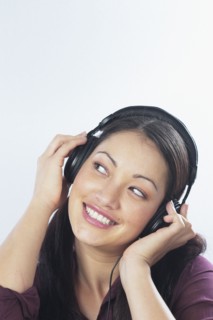 Young woman listening to headphones