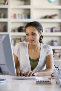 African American woman typing on computer