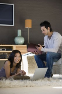 Asian couple working at home