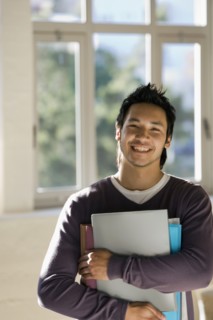 Asian man holding binders
