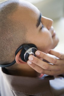 African American man listening to headphones